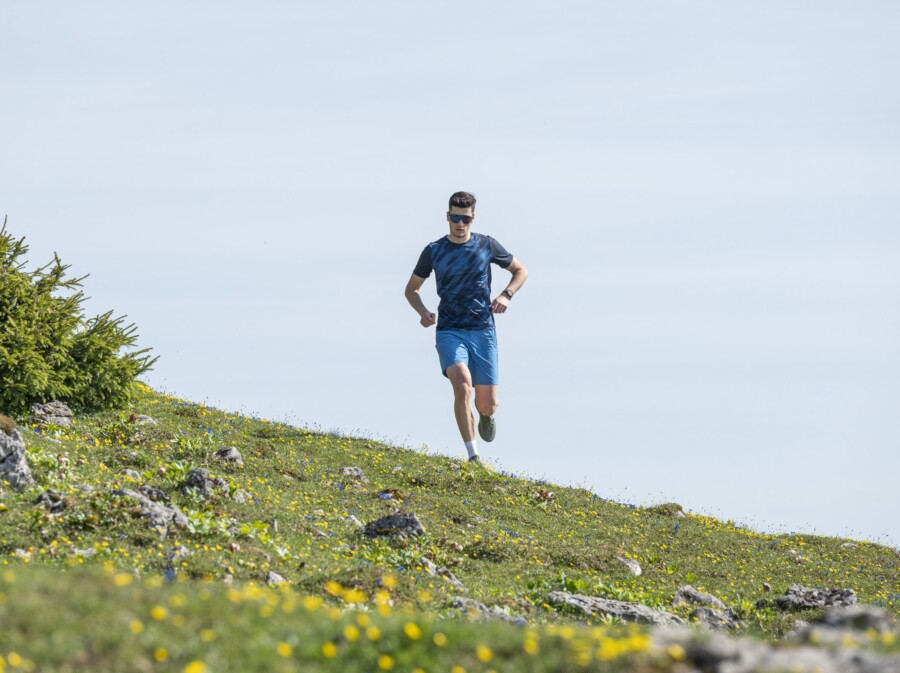 Man running down a hill.