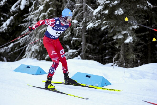 Nordic skier in Löffler racing suit.