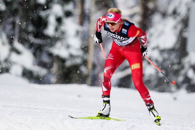 Nordic skier in Löffler racing suit.