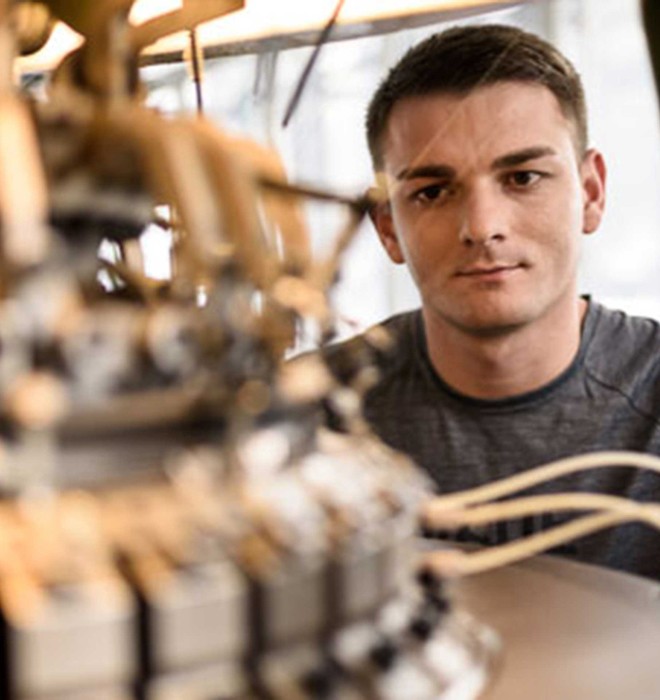 Man working with stitching machine.