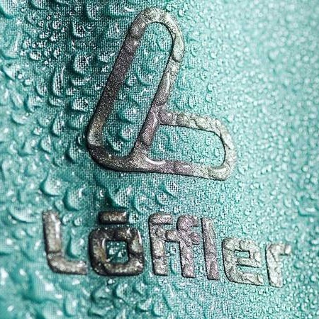 Löffler Logo on fabric with water drops.